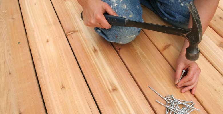 man performing verandah and deck repair